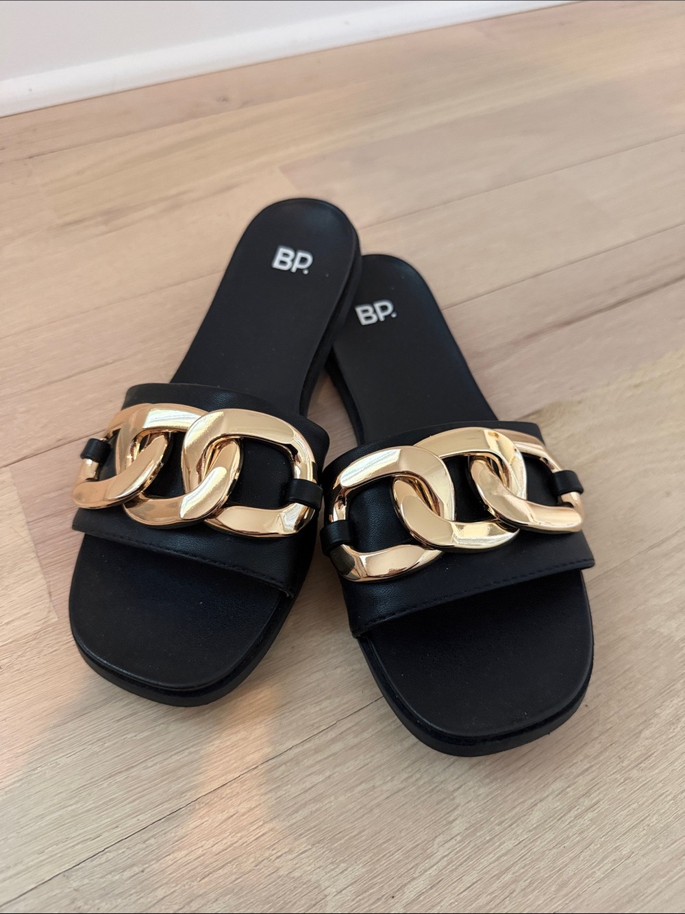 bp Black Slide Sandals with Large Gold Chain Accent